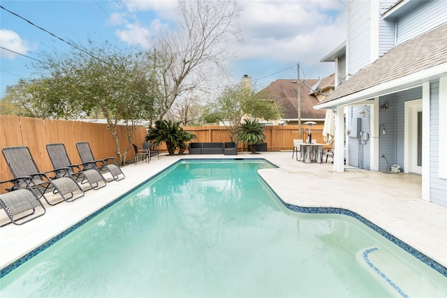 view of pool featuring a patio, a fenced backyard, and a fenced in pool