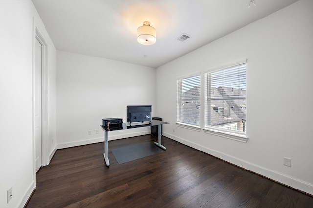 2721 Maxroy St, Houston, TX 77007 - office area with dark wood-style floors, visible vents, and baseboards