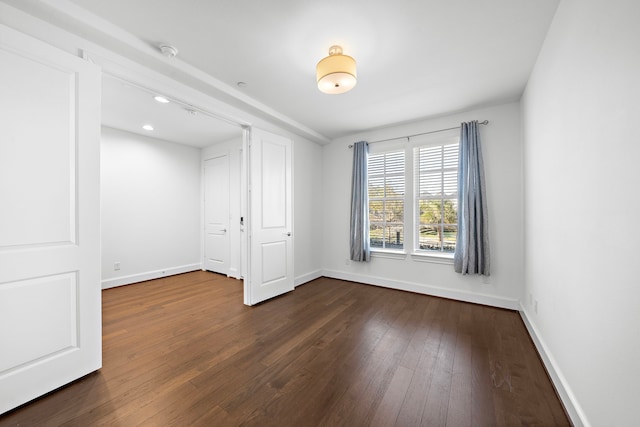 2721 Maxroy St, Houston, TX 77007 - empty room with dark wood-type flooring and baseboards