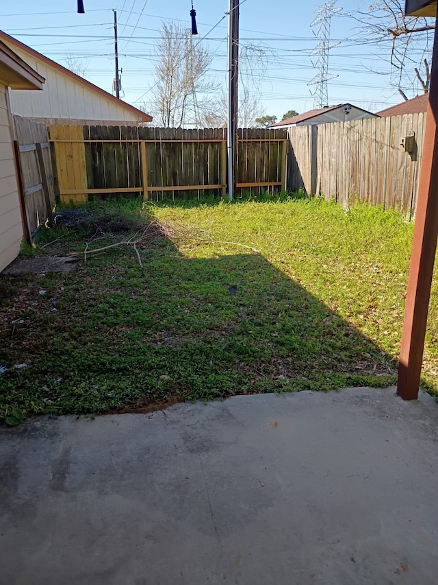 view of yard with a fenced backyard