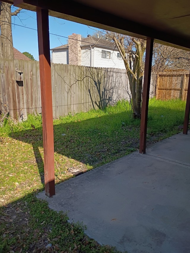 view of yard featuring a patio and fence