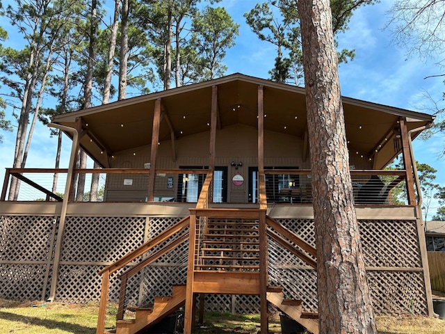 back of house featuring stairs