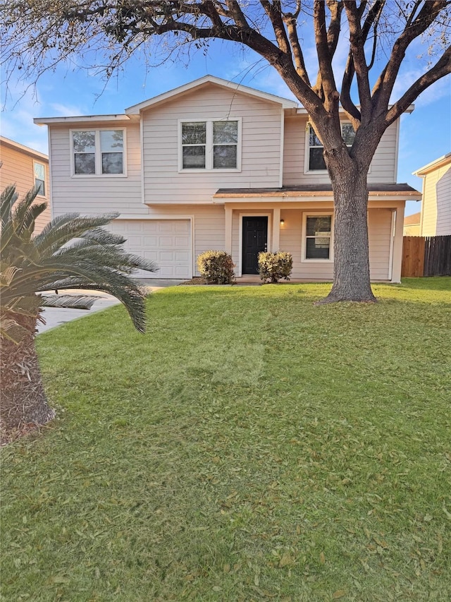 traditional home with a garage, a front yard, and fence