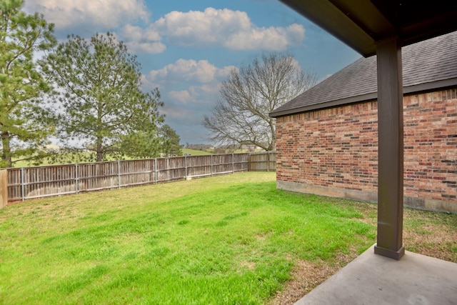 view of yard with a fenced backyard