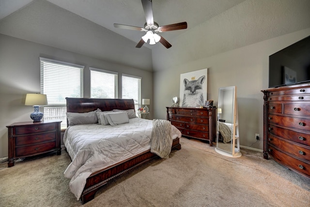 bedroom featuring baseboards, lofted ceiling, carpet, and a ceiling fan