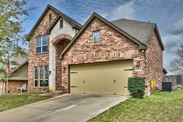 view of front of home featuring cooling unit, roof with shingles, concrete driveway, a garage, and brick siding