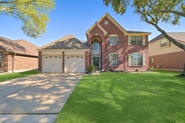 colonial home with brick siding, a shingled roof, concrete driveway, a front yard, and an attached garage