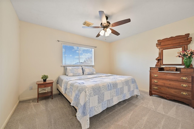 bedroom with light carpet, a ceiling fan, and baseboards