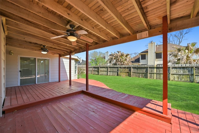 wooden terrace featuring a yard, fence, and ceiling fan