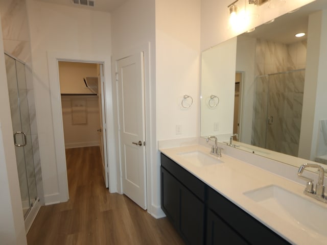 8035 Kay Harbor Dr, Cypress, TX 77433 - full bath with wood finished floors, a marble finish shower, and double vanity