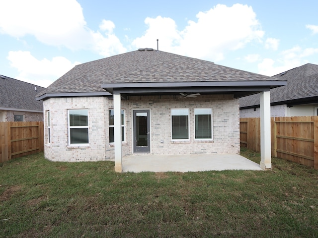 8035 Kay Harbor Dr, Cypress, TX 77433 - back of property featuring a shingled roof, a fenced backyard, brick siding, a patio, and a ceiling fan