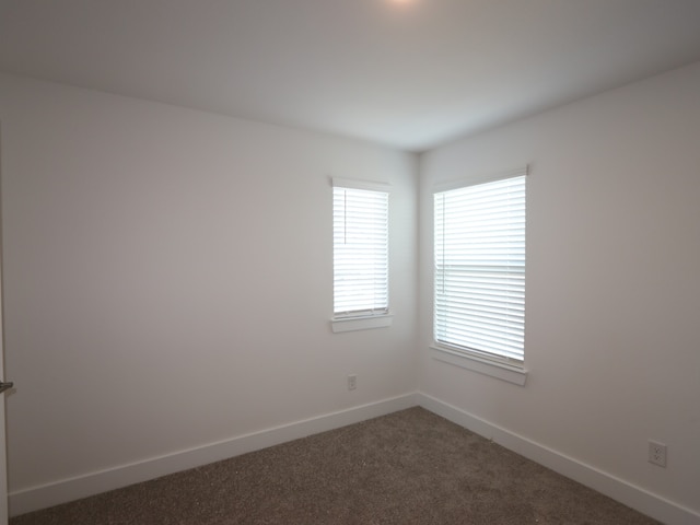 8035 Kay Harbor Dr, Cypress, TX 77433 - spare room featuring dark carpet and baseboards