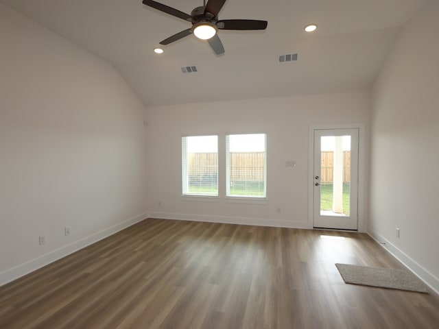 8035 Kay Harbor Dr, Cypress, TX 77433 - unfurnished room featuring vaulted ceiling, wood finished floors, ceiling fan, and recessed lighting