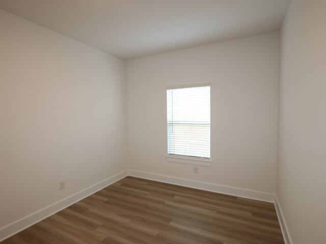 8035 Kay Harbor Dr, Cypress, TX 77433 - unfurnished room with baseboards and dark wood finished floors