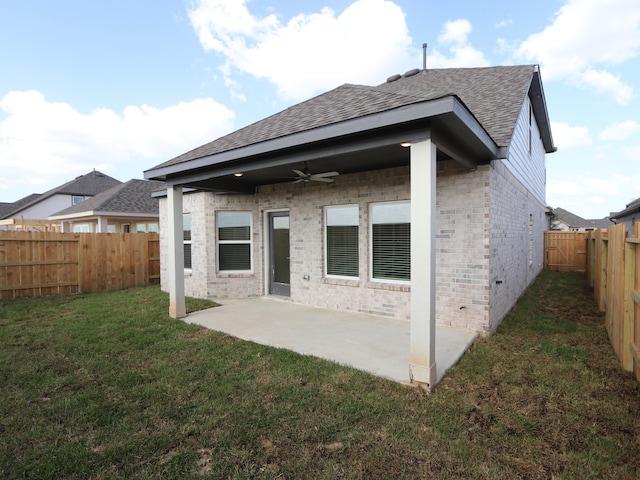 8035 Kay Harbor Dr, Cypress, TX 77433 - rear view of property with a ceiling fan, a shingled roof, brick siding, a fenced backyard, and a patio area