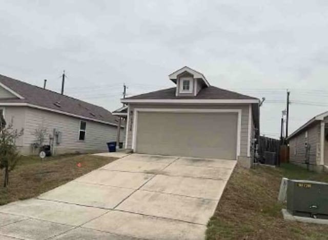 exterior space featuring cooling unit and concrete driveway