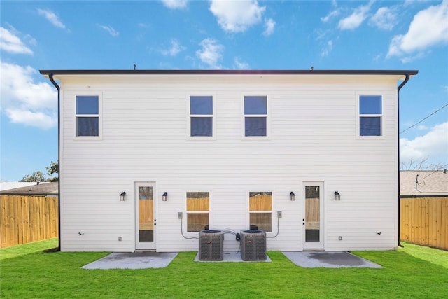 back of house with a patio, central air condition unit, a yard, and a fenced backyard