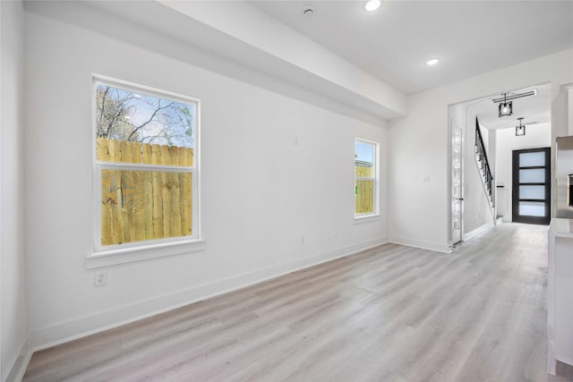 interior space with stairway, recessed lighting, baseboards, and light wood-type flooring