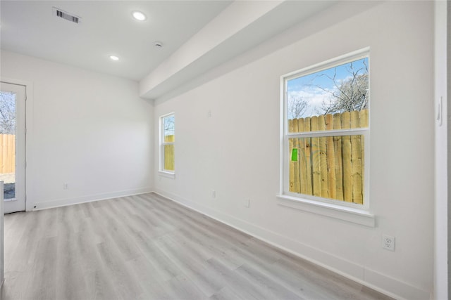 empty room with recessed lighting, visible vents, baseboards, and light wood-style flooring