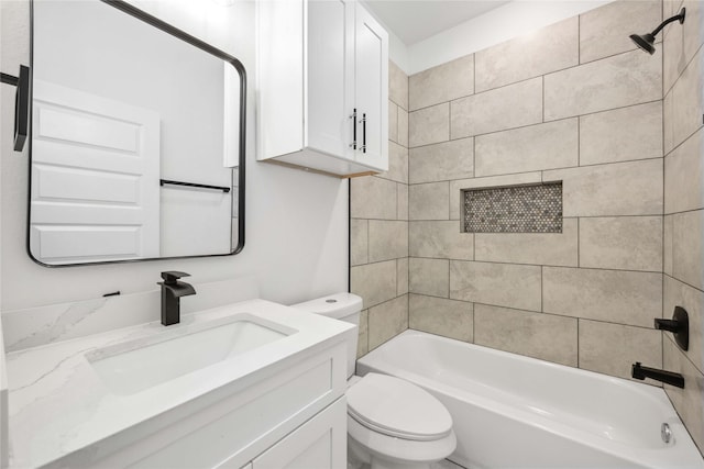 bathroom with toilet, vanity, and bathing tub / shower combination