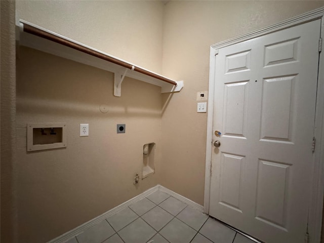 washroom featuring laundry area, light tile patterned floors, hookup for a gas dryer, and electric dryer hookup