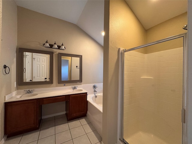 bathroom featuring tile patterned floors, a sink, a shower stall, a bath, and vaulted ceiling