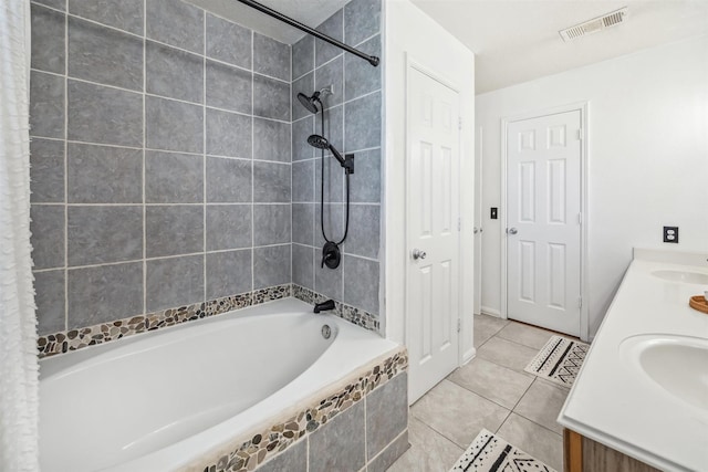 bathroom with visible vents, double vanity, a sink, tile patterned flooring, and bathing tub / shower combination