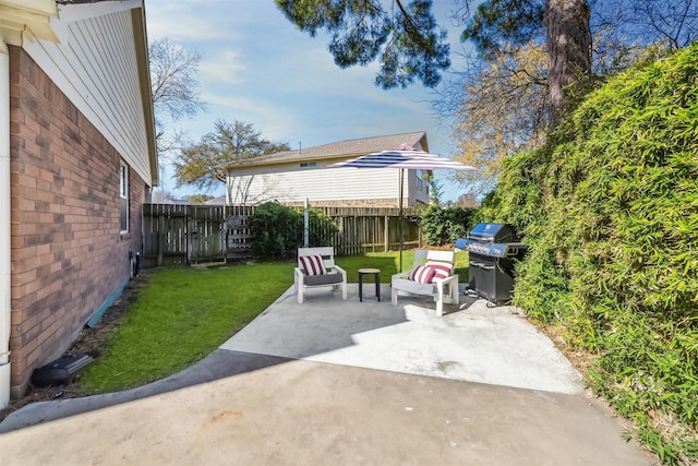 view of patio / terrace featuring area for grilling, a fenced backyard, and outdoor lounge area