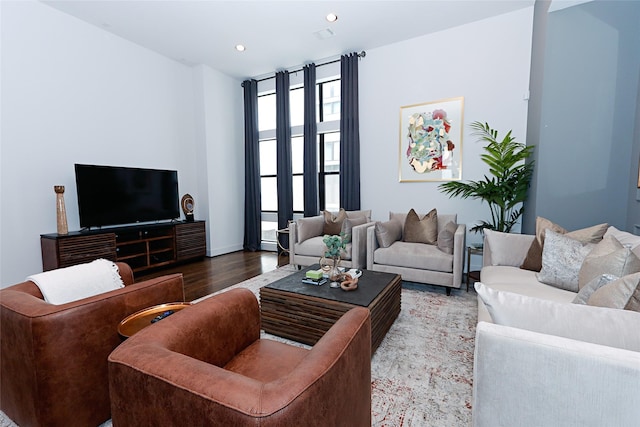 living room with recessed lighting and wood finished floors