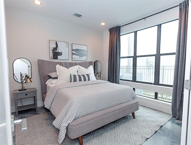 bedroom with multiple windows, recessed lighting, visible vents, and baseboards