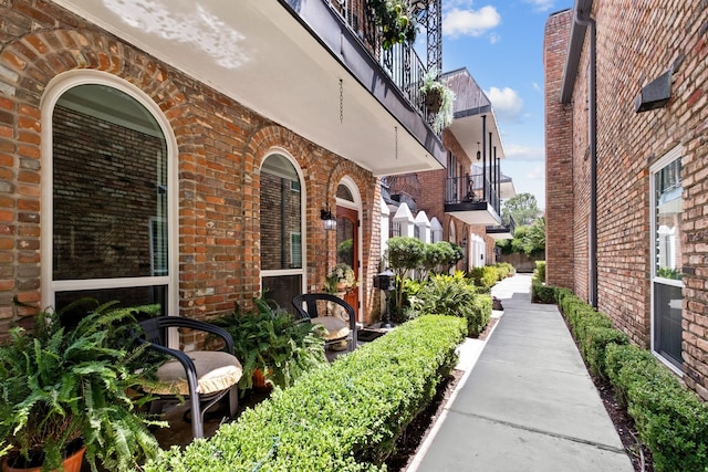 view of side of property featuring brick siding