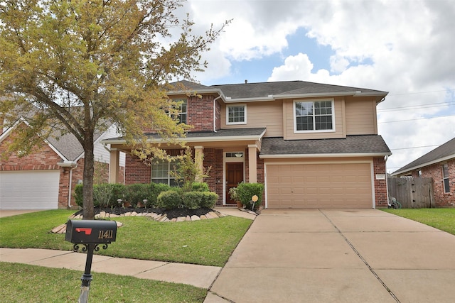 view of front facade featuring driveway, fence, an attached garage, a front yard, and brick siding