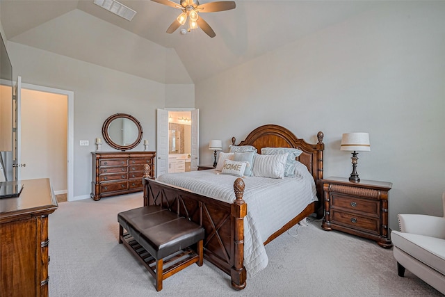 carpeted bedroom featuring visible vents, ceiling fan, baseboards, lofted ceiling, and ensuite bathroom