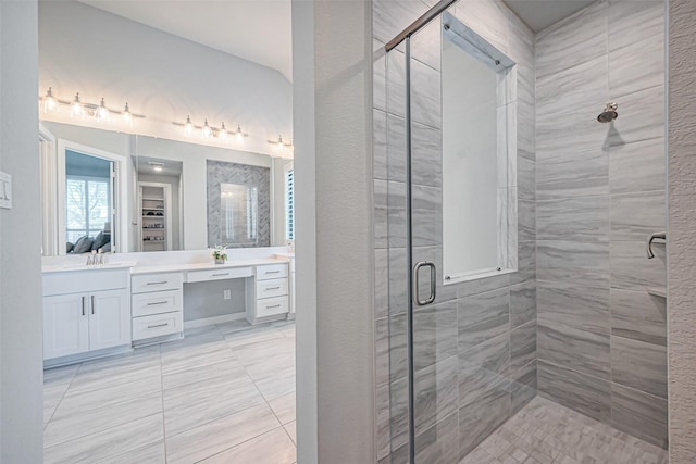 bathroom featuring a stall shower and vanity