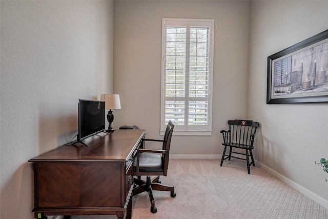 office space with baseboards and carpet