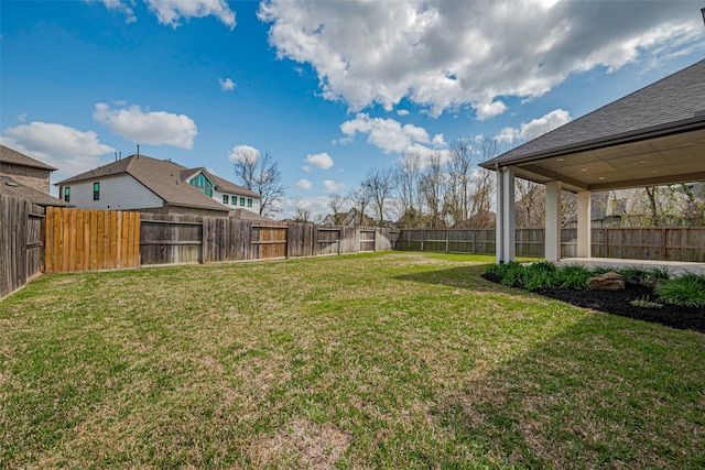 view of yard featuring a fenced backyard