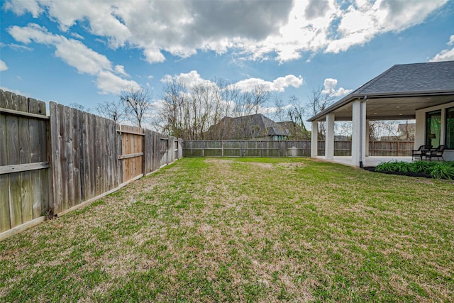 view of yard with a patio area and a fenced backyard