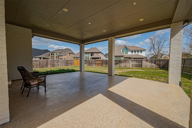 view of patio / terrace featuring a residential view and a fenced backyard