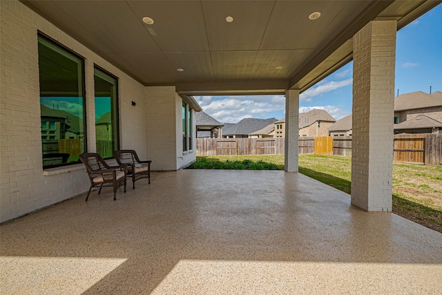 view of patio with a residential view and fence private yard