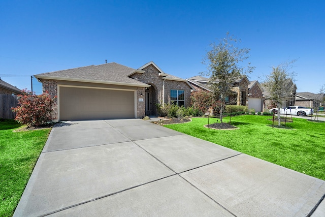 view of front of house featuring driveway, a shingled roof, an attached garage, a front yard, and brick siding