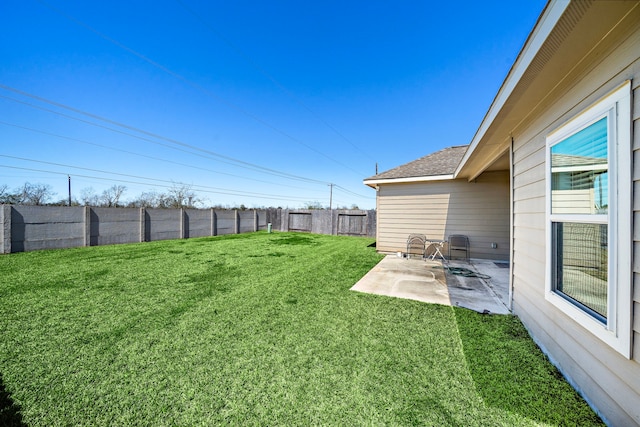 view of yard featuring a patio and fence