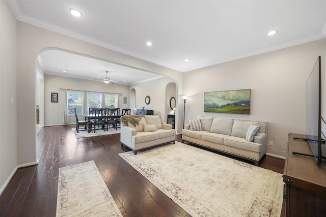 living area featuring recessed lighting, baseboards, arched walkways, and dark wood-style flooring