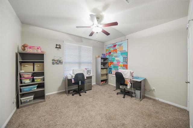 office area featuring carpet, baseboards, and ceiling fan