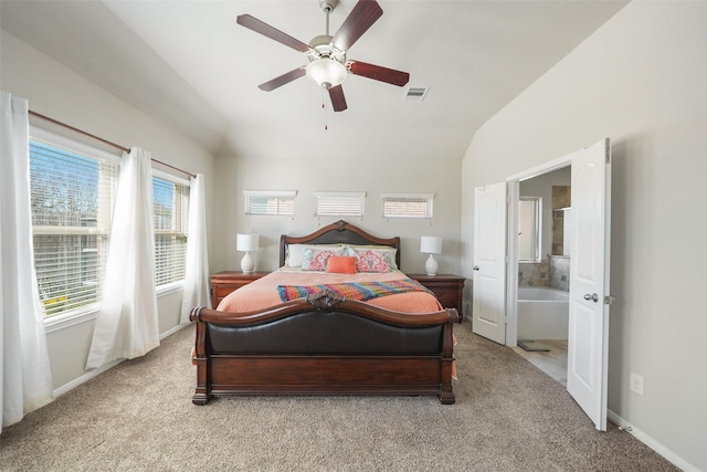 bedroom featuring baseboards, visible vents, ceiling fan, vaulted ceiling, and light carpet