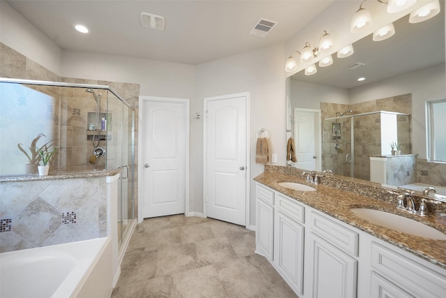 full bath with a garden tub, visible vents, a shower stall, and a sink