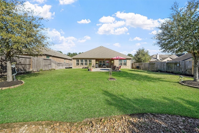 view of yard featuring a patio and a fenced backyard