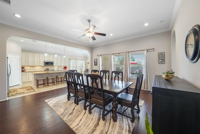 dining room with recessed lighting, light wood-type flooring, a ceiling fan, and ornamental molding