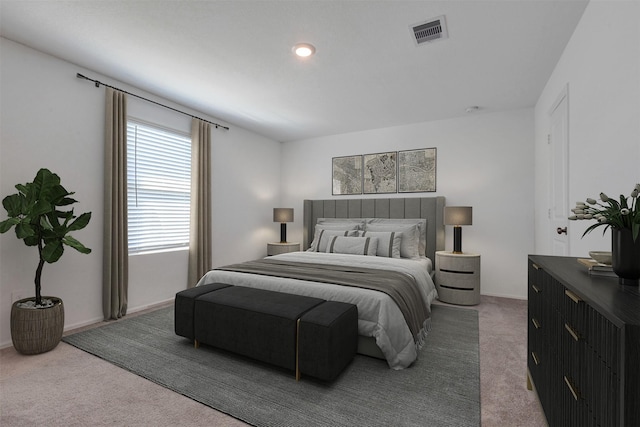 carpeted bedroom featuring visible vents and baseboards