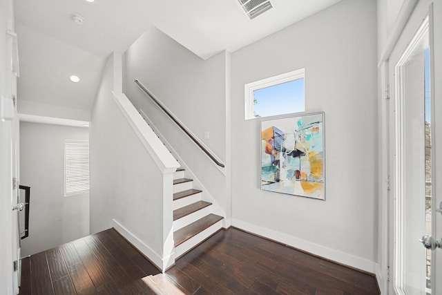 stairs with visible vents, recessed lighting, baseboards, and hardwood / wood-style floors