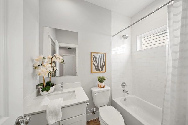 full bathroom featuring vanity, toilet, and shower / tub combo with curtain